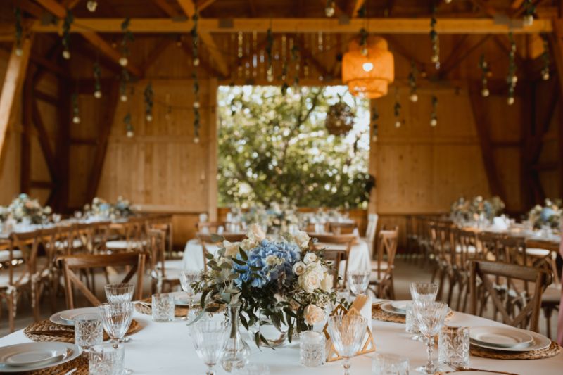 A rustic wedding reception with beautiful table decoration